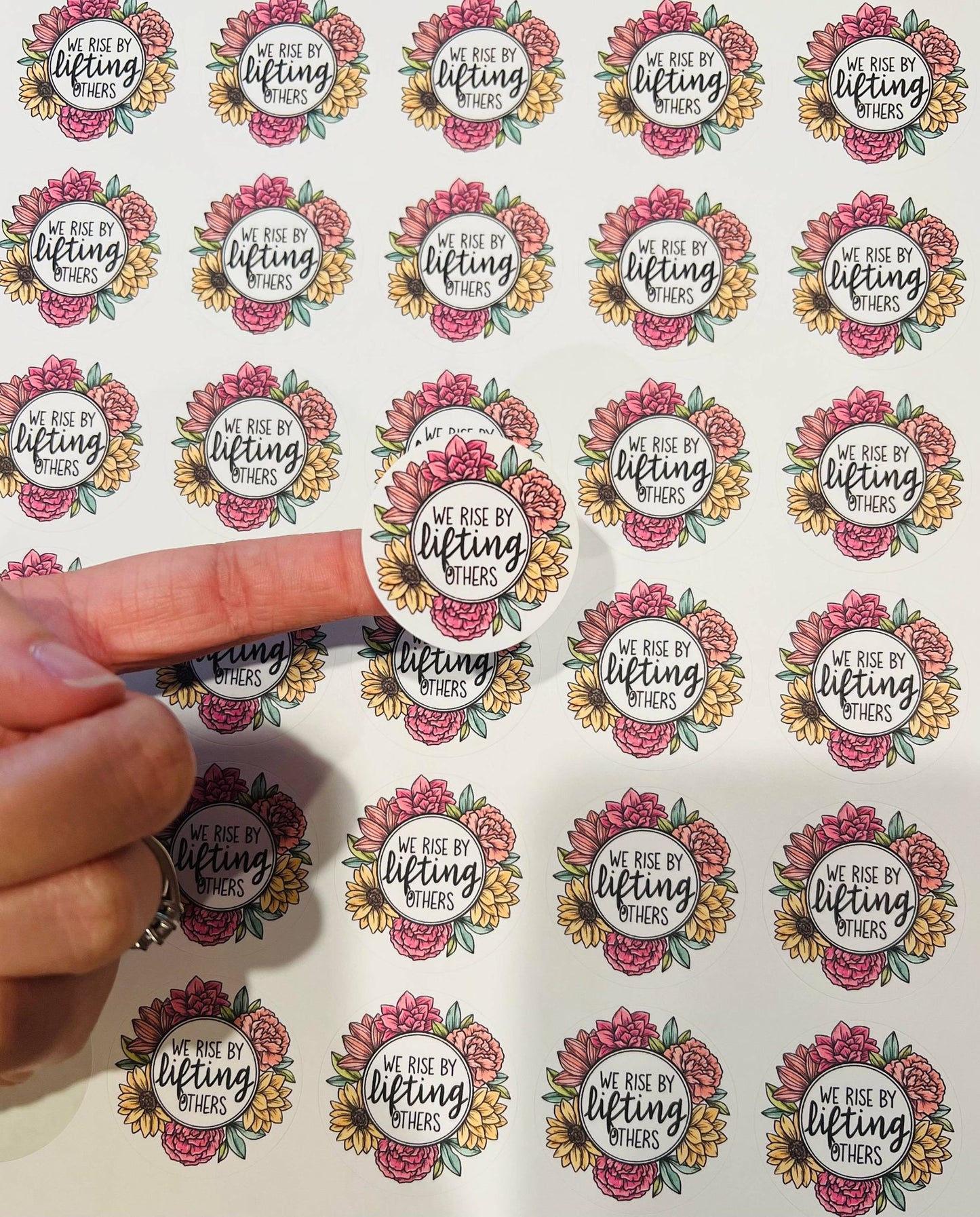 #134 we rise by lifting others 1.5 inch stickers